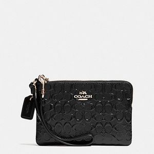 Super cute black COACH wristlet.